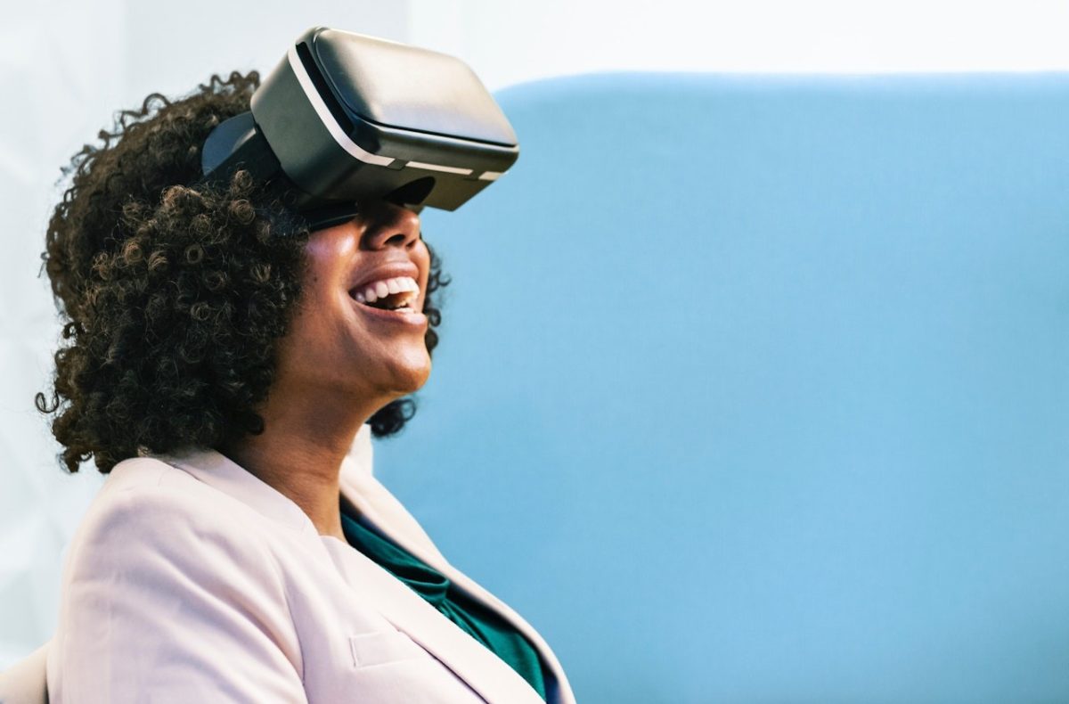 A woman of colour wears a VR headset