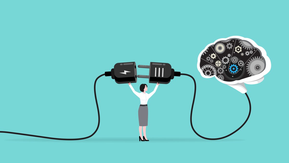 person holding two end of a plug connection to connect a brain with computer elements in it